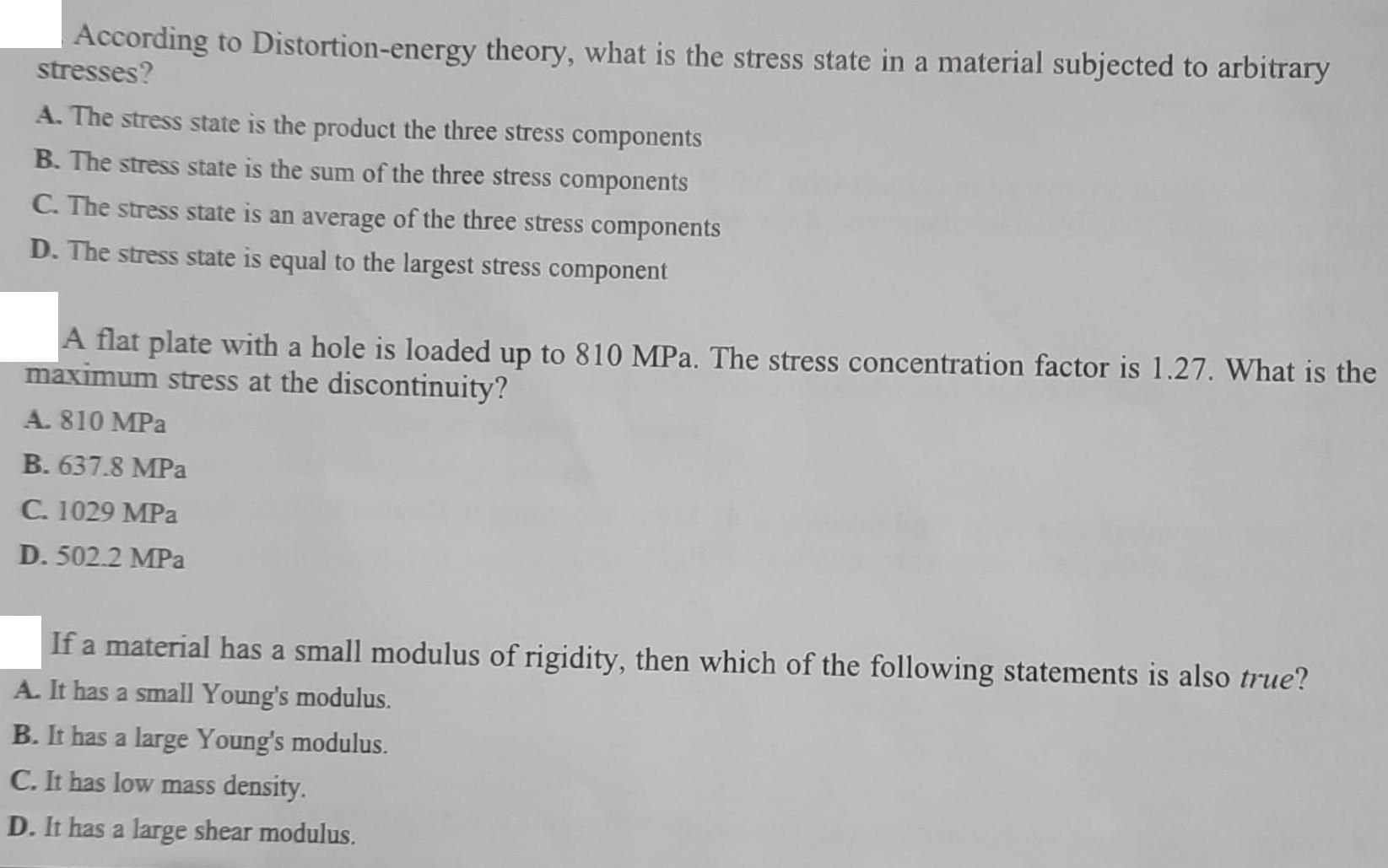 According to Distortion-energy theory, what is the stress state in a material subjected to arbitrary