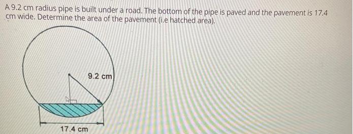 A 9.2 cm radius pipe is built under a road. The bottom