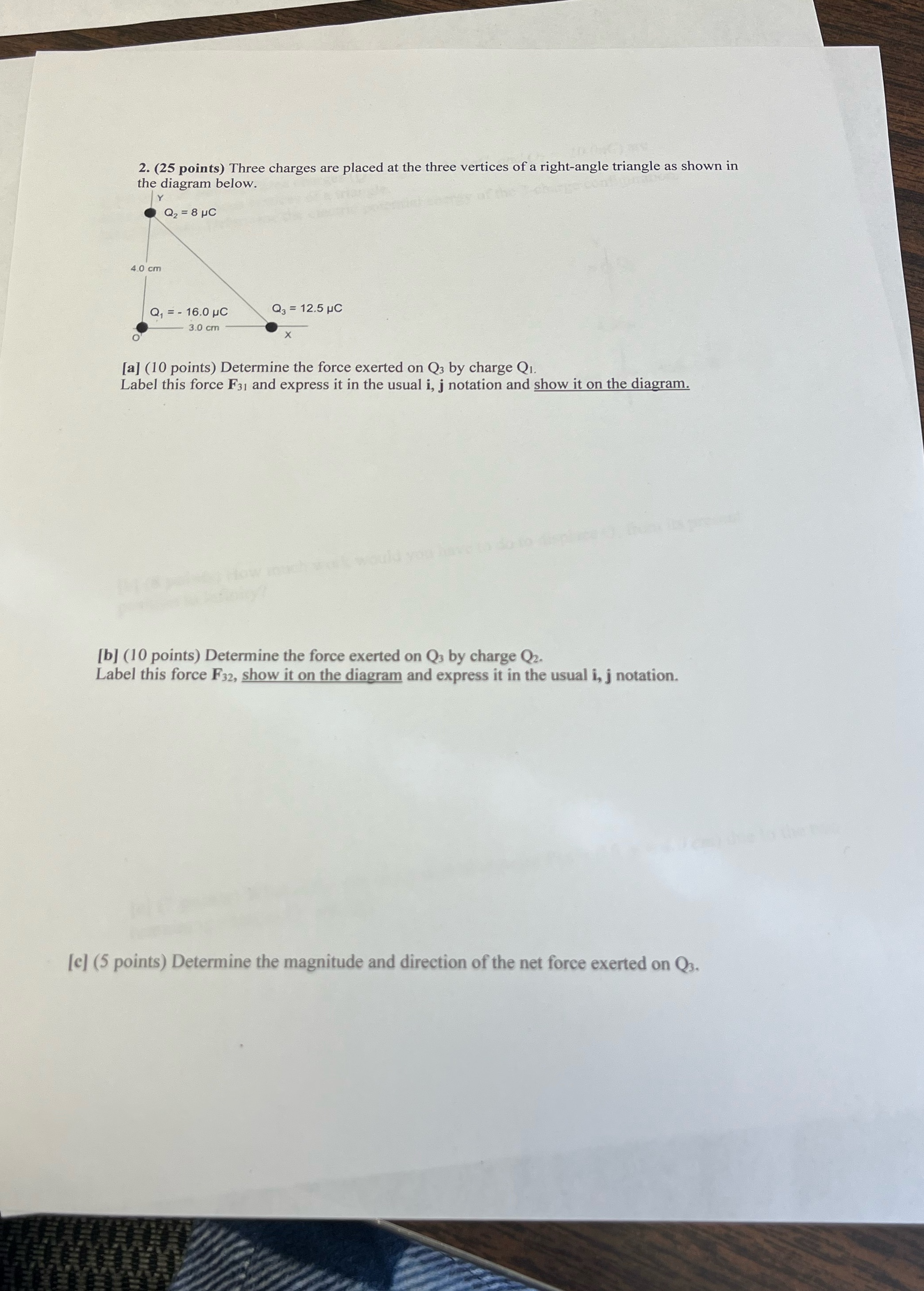 2. (25 points) Three charges are placed at the three vertices