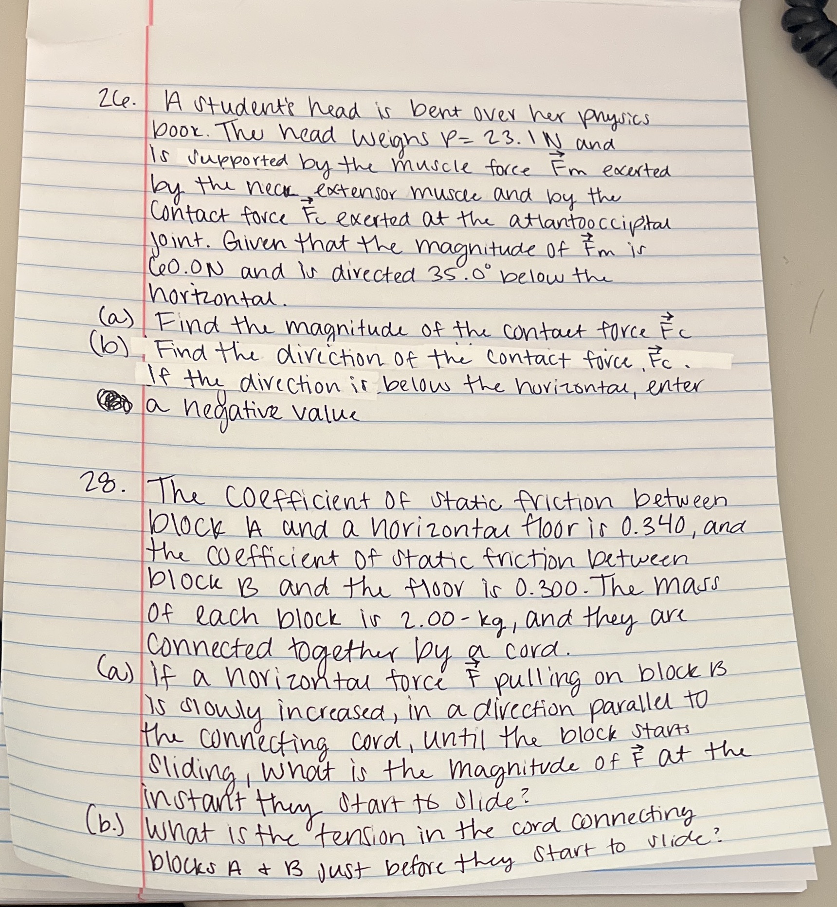  Zce. A student's head is bent over her physics book .