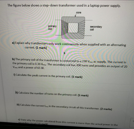  The figure below shows a step-down transformer used in a laptop