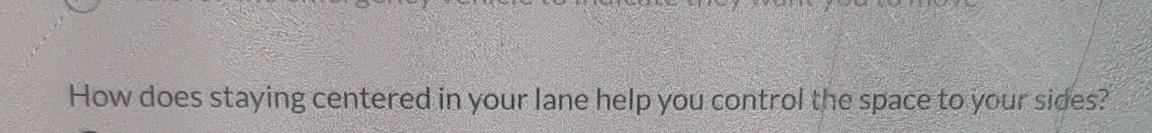  How does staying centered in your lane help you control the