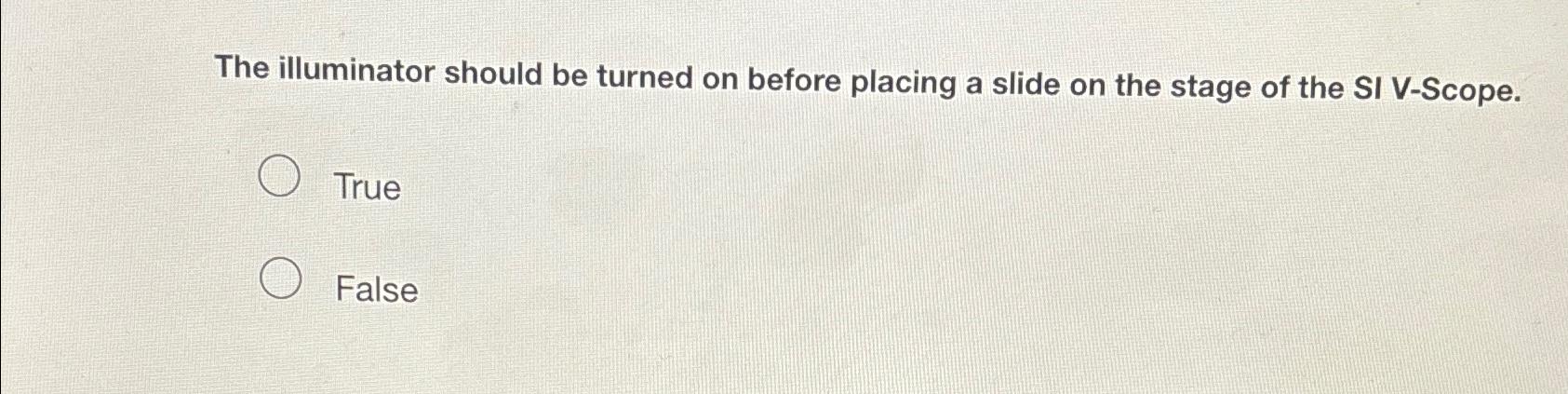  The illuminator should be turned on before placing a slide on