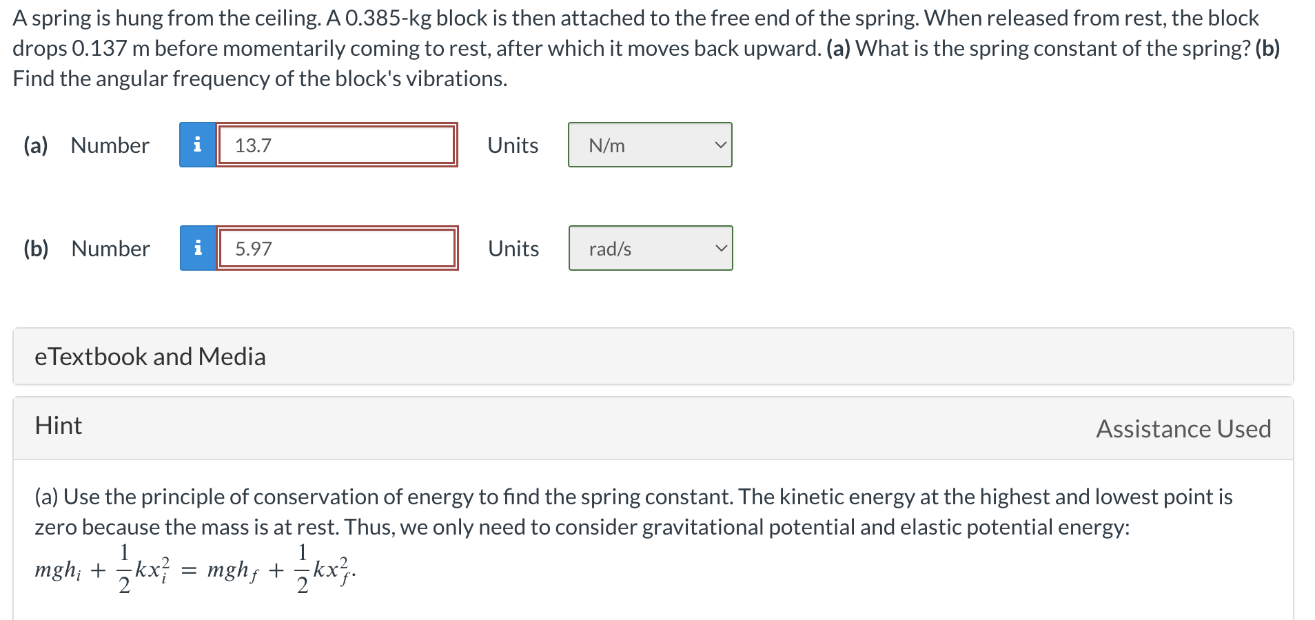  A spring is hung from the ceiling. A 0.385-kg block is