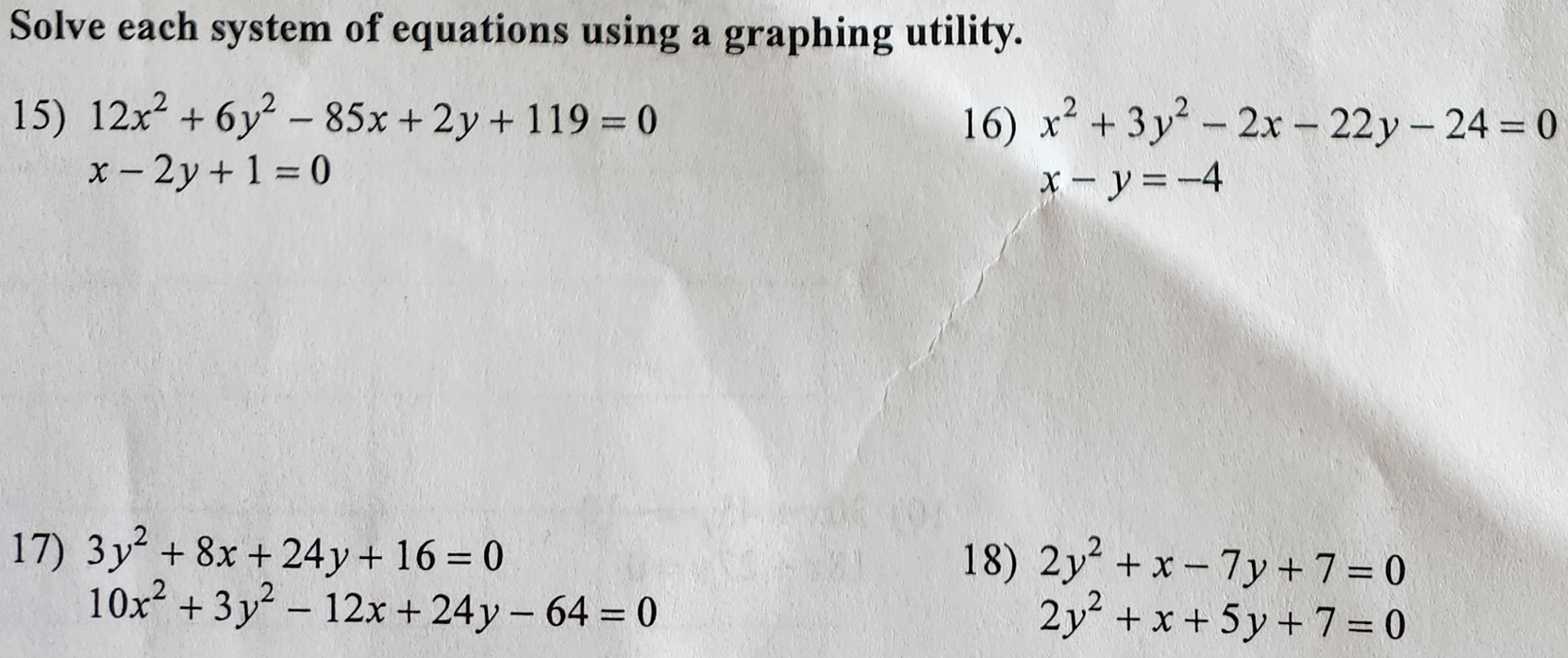  Solve each system of equations using a graphing utility. 15) 12x2