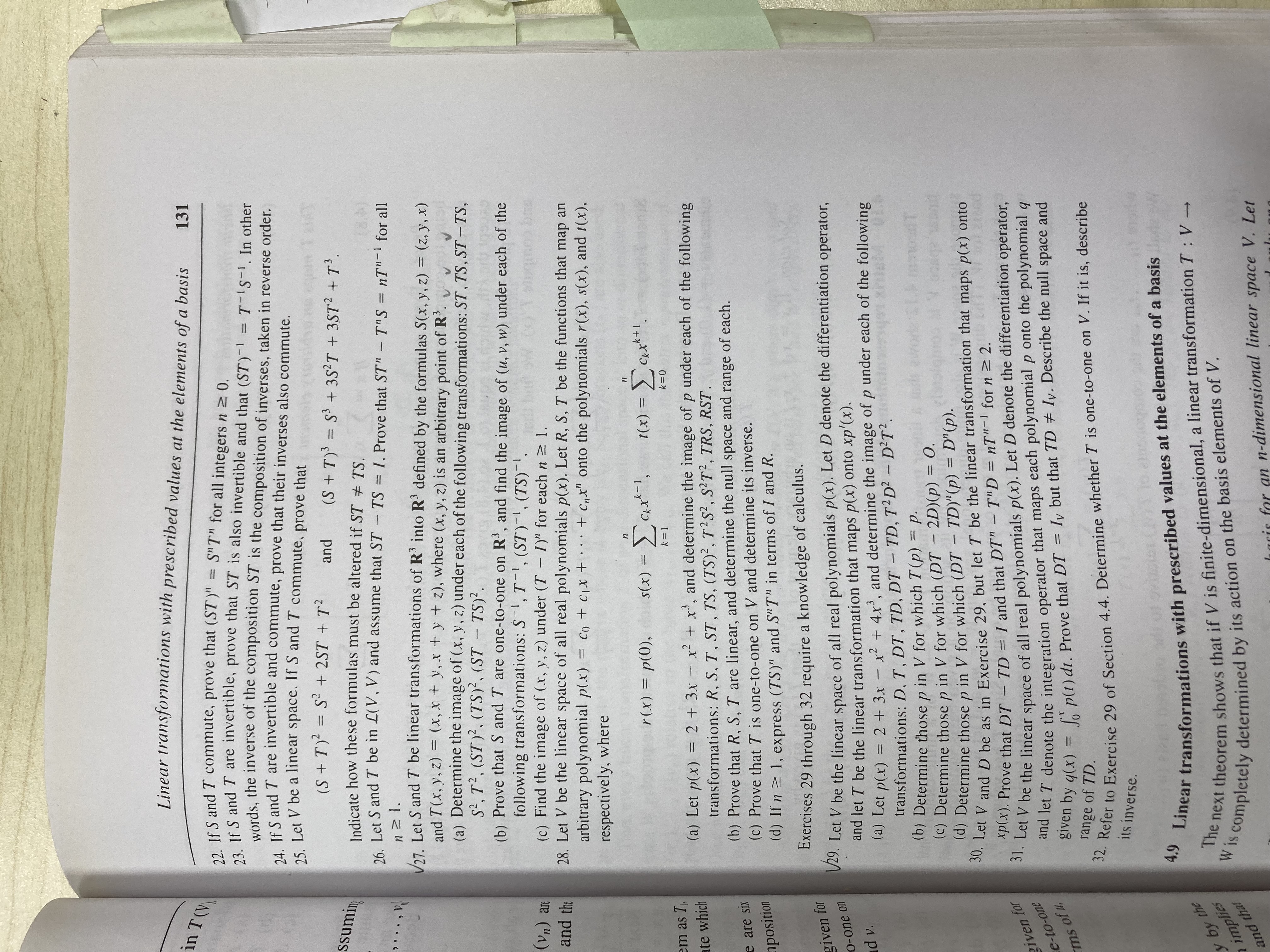 Linear transformations with prescribed values at the elements of a basis