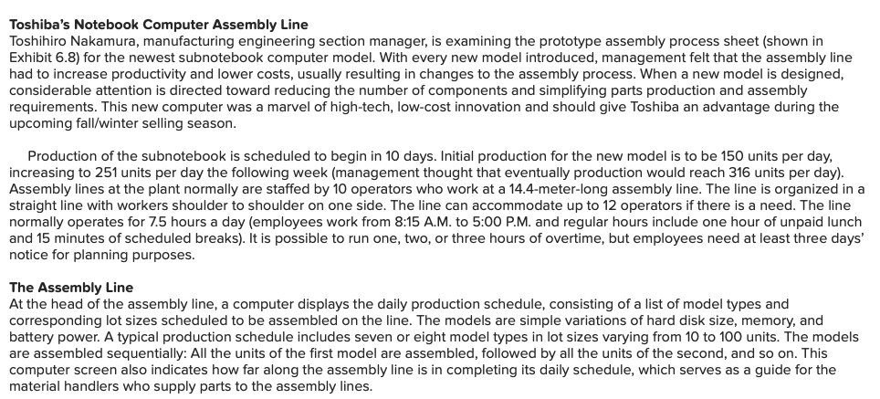 Toshihiro Nakamura, manufacturing engineering section manager, is examining the prototype assembly