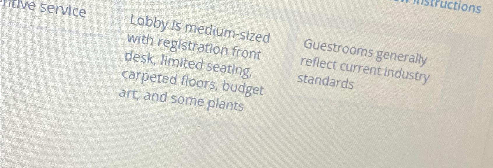  Lobby is medium-sized with registration front desk, limited seating. carpeted floors,