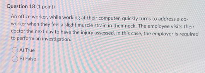  An office worker, while working at their computer, quickly turns to