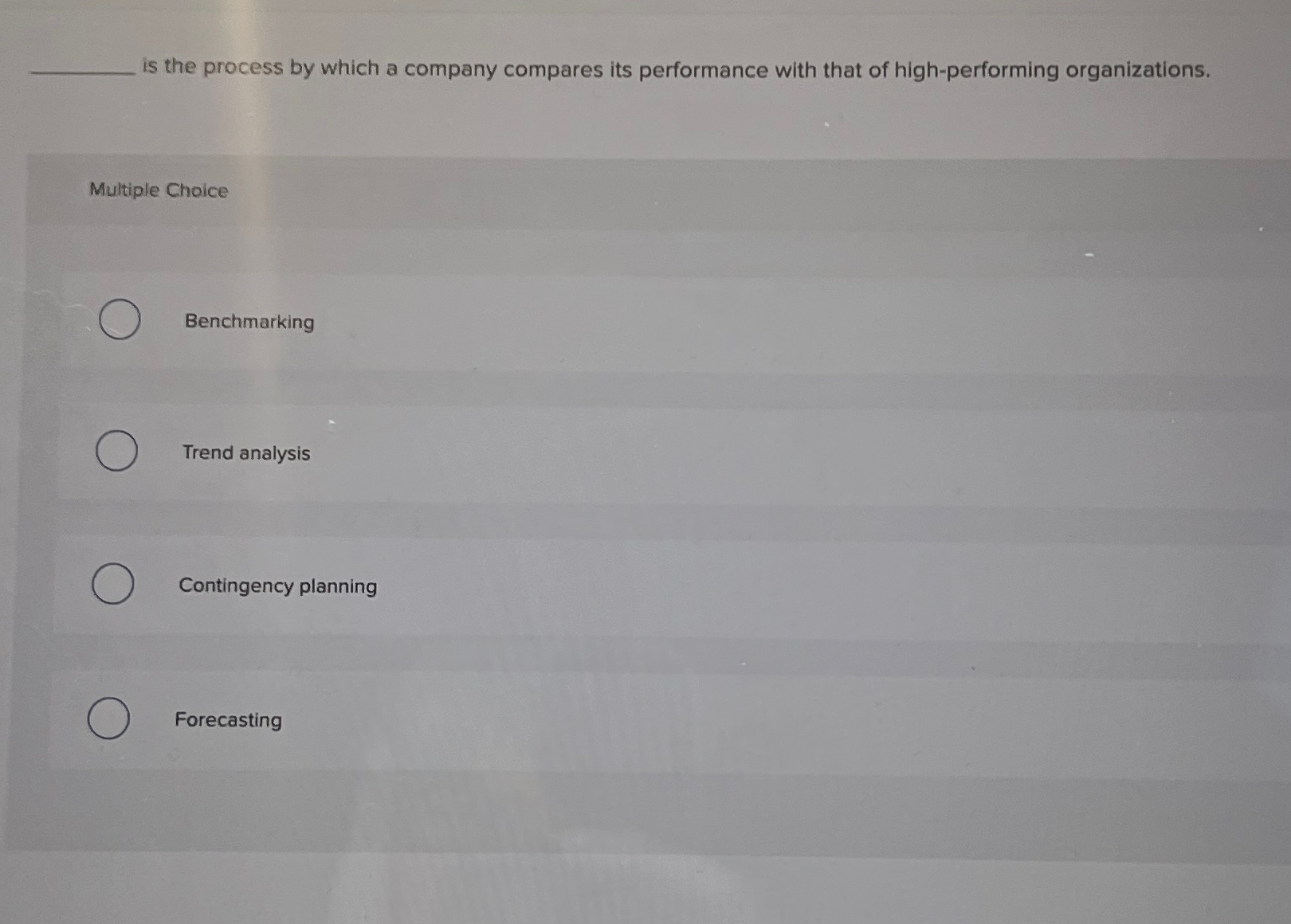  is the process by which a company compares its performance with