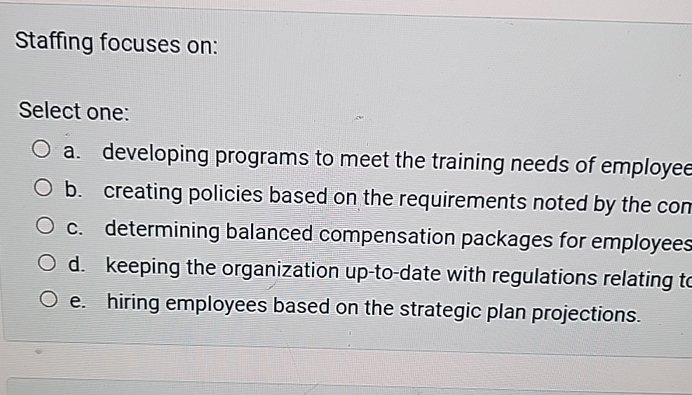  Staffing focuses on: Select one: a. developing programs to meet the