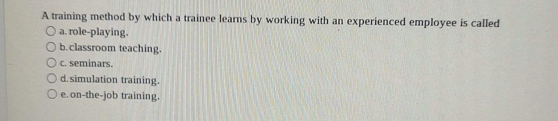  A training method by which a trainee learns by working with