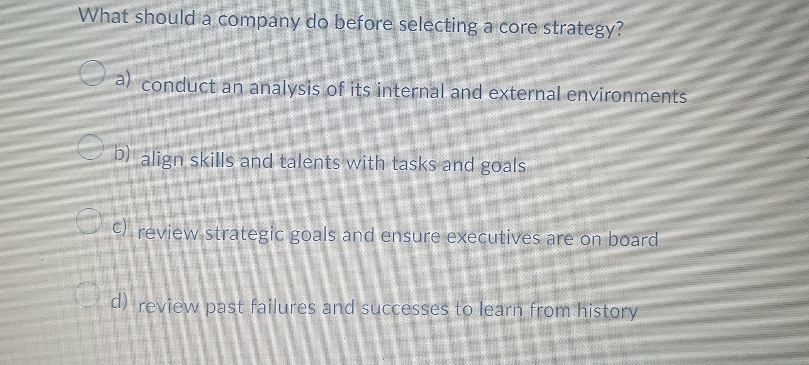  What should a company do before selecting a core strategy? a)