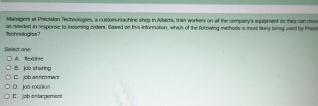  Managers at Precision Technologies, a custom-machine shop in Aberta, train workers