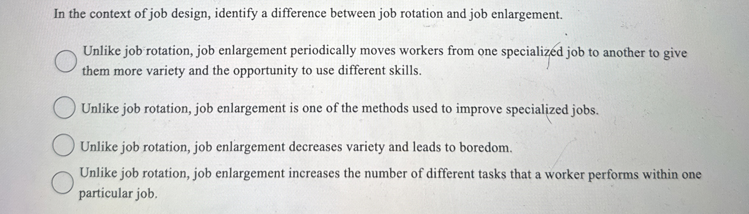  In the context of job design, identify a difference between job