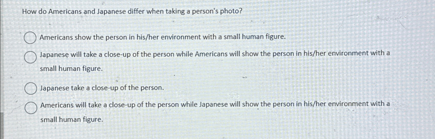  How do Americans and Japanese differ when taking a person's photo?