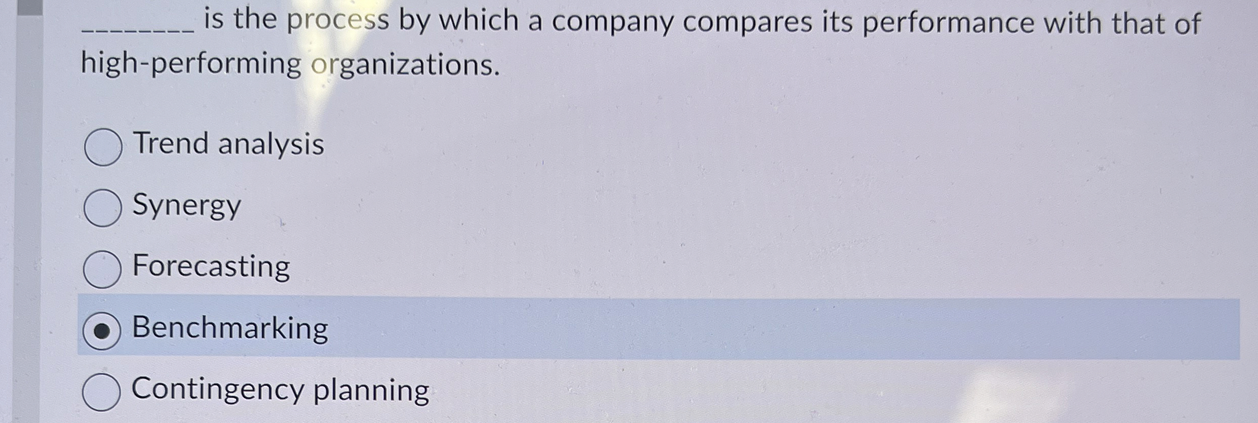  q, is the process by which a company compares its performance
