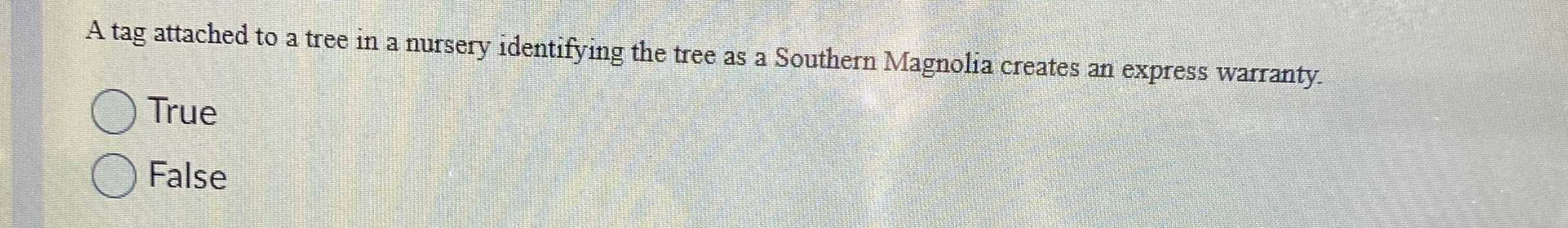  A tag attached to a tree in a nursery identifying the