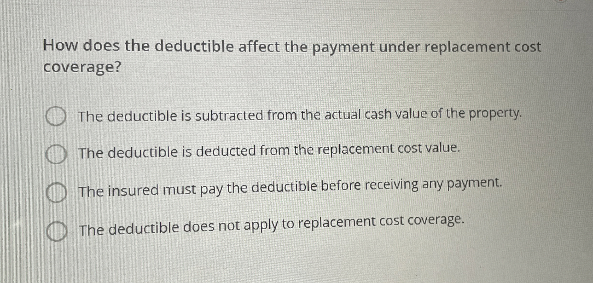  How does the deductible affect the payment under replacement cost coverage?