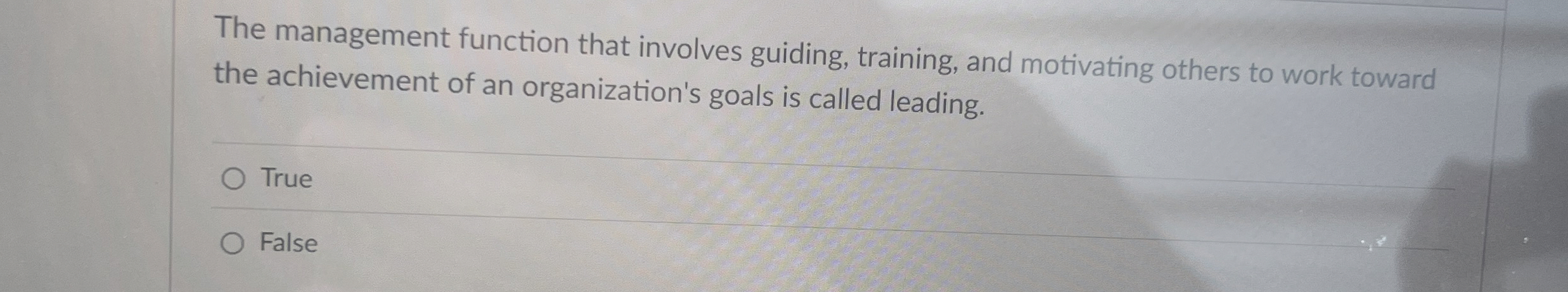  The management function that involves guiding, training, and motivating others to