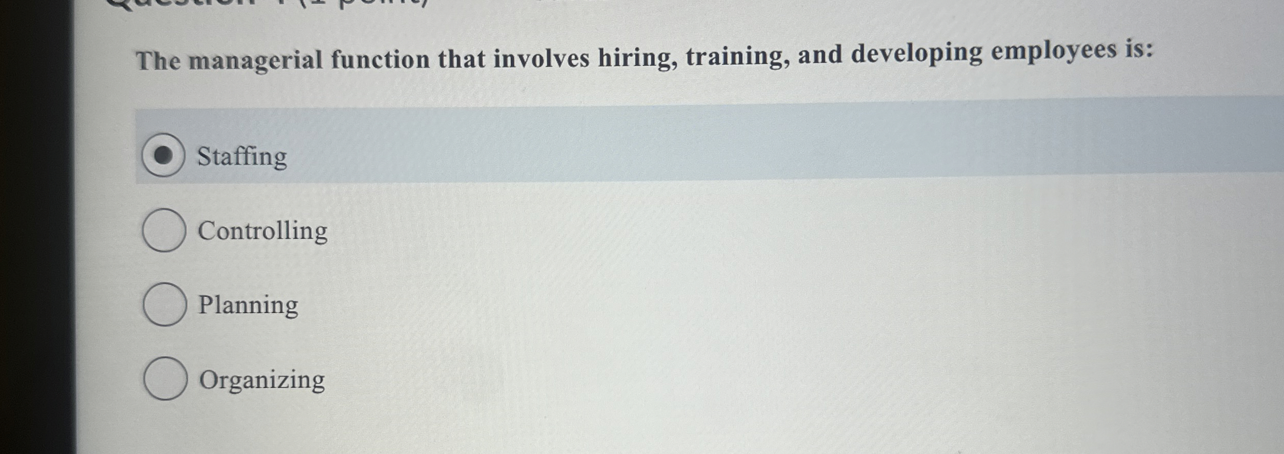  The managerial function that involves hiring, training, and developing employees is: