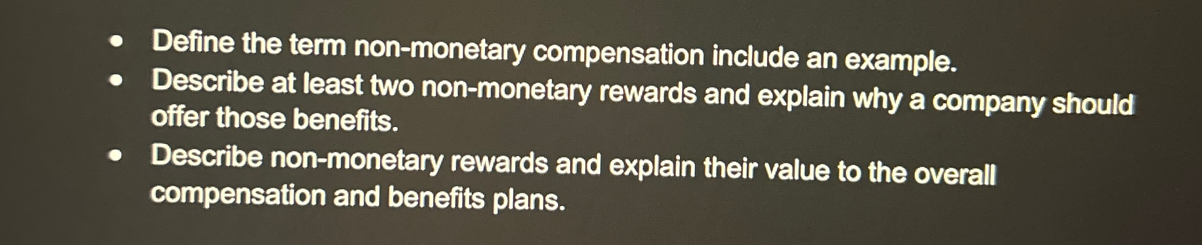  Define the term non-monetary compensation include an example. Describe at least
