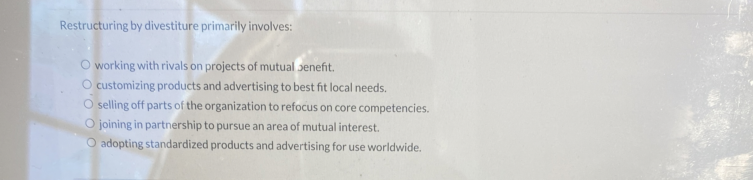  Restructuring by divestiture primarily involves: working with rivals on projects of