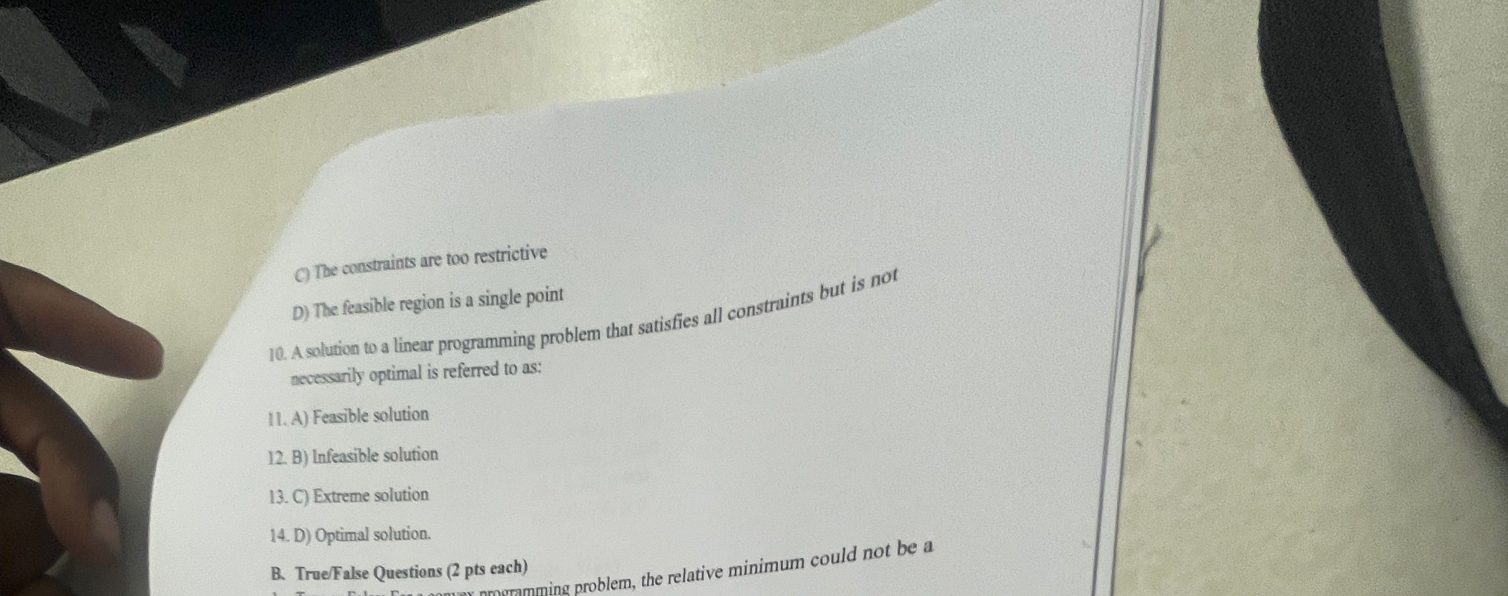  C) The constraints are too restrictive D) The feasible region is