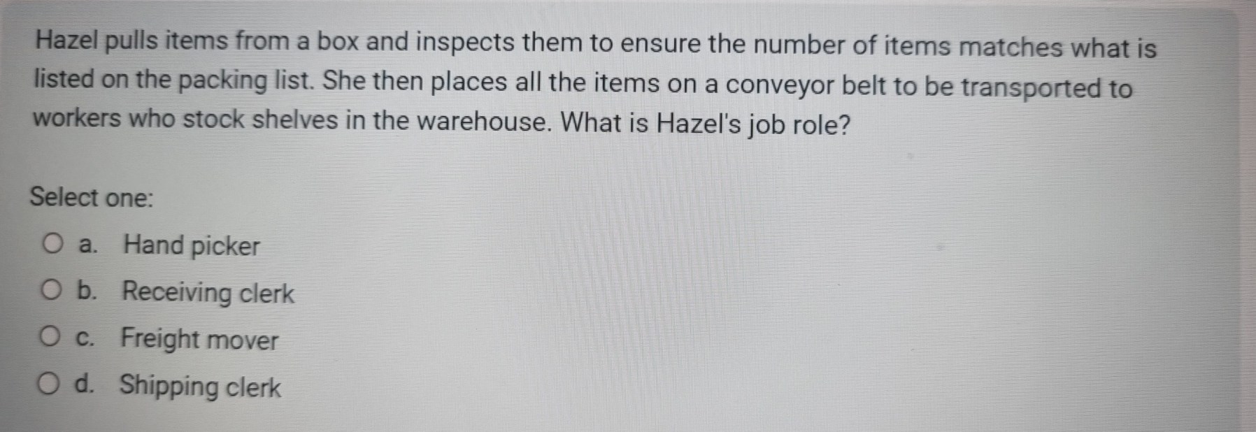  Hazel pulls items from a box and inspects them to ensure