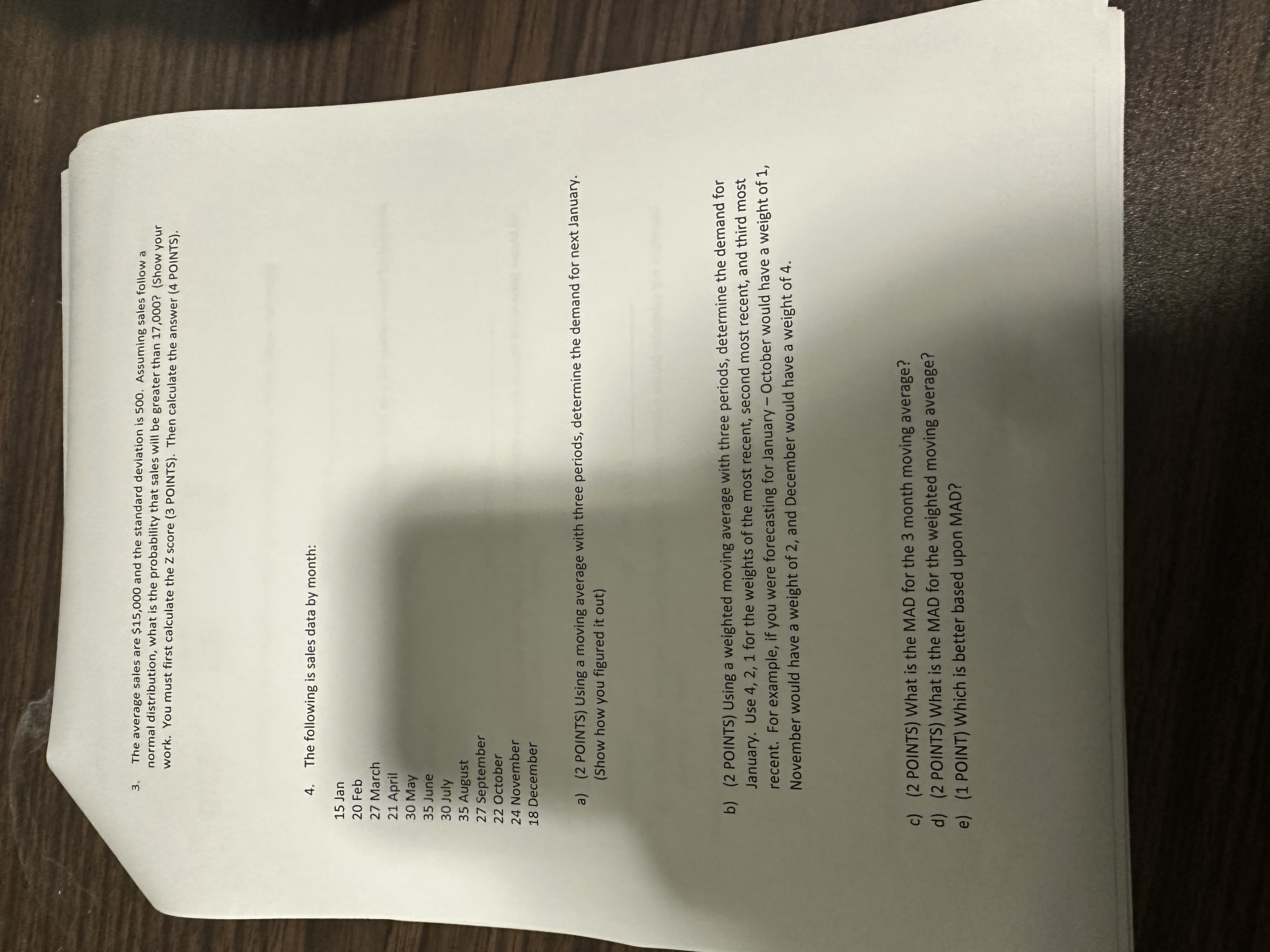  The average sales are $15,000 and the standard deviation is 500.