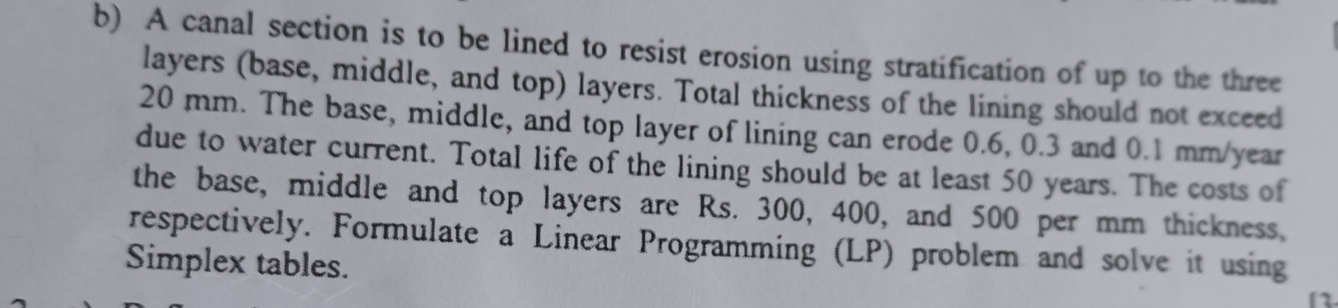  b) A canal section is to be lined to resist erosion