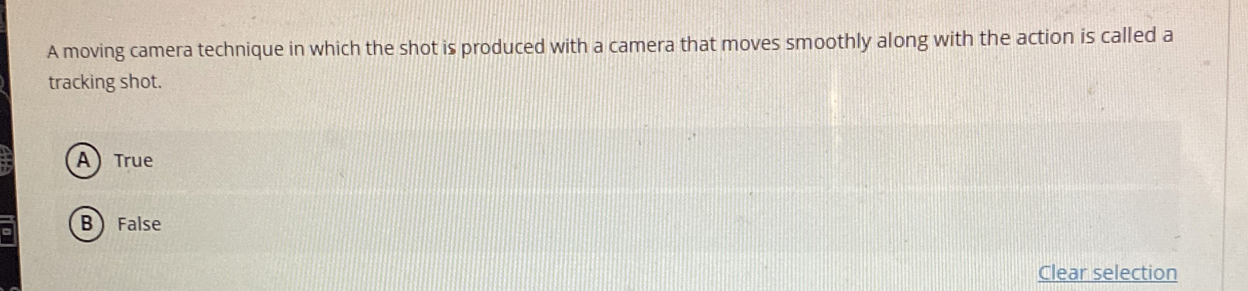  A moving camera technique in which the shot is produced with