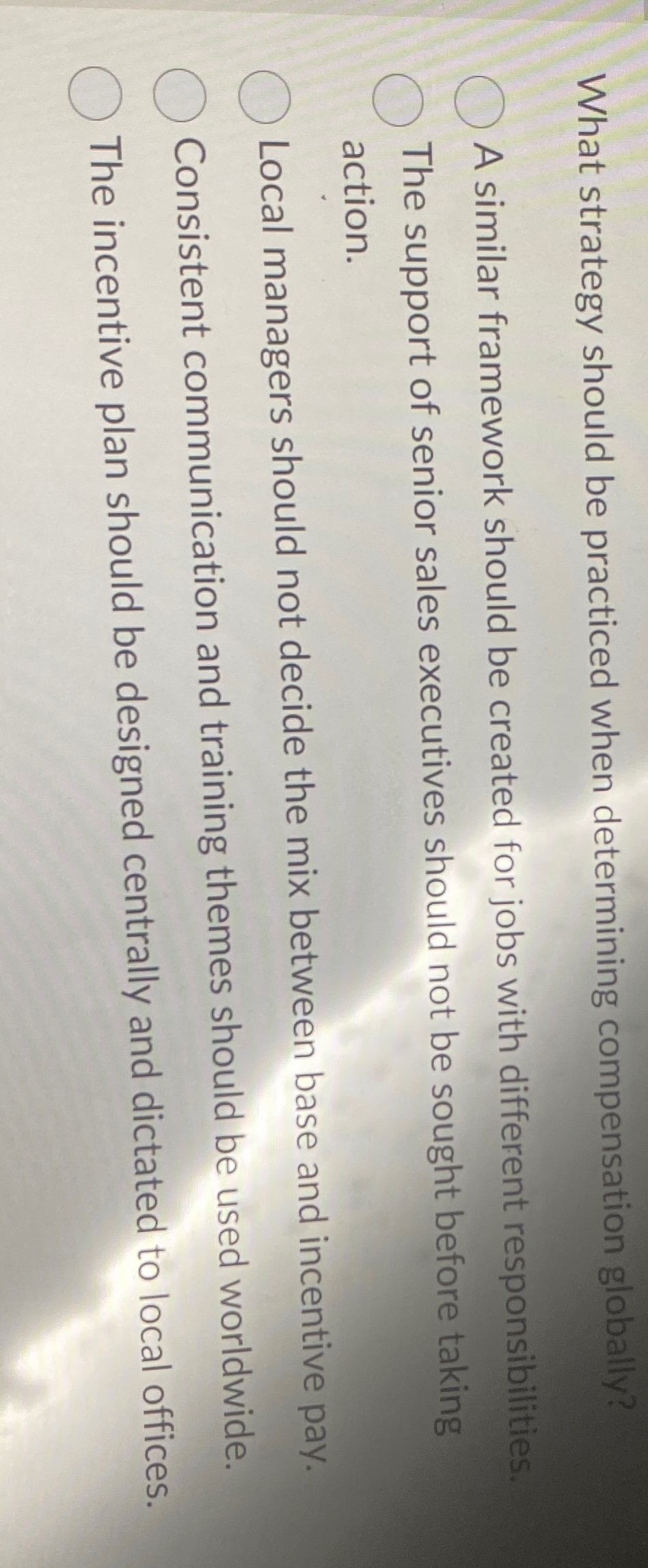  What strategy should be practiced when determining compensation globally? A similar