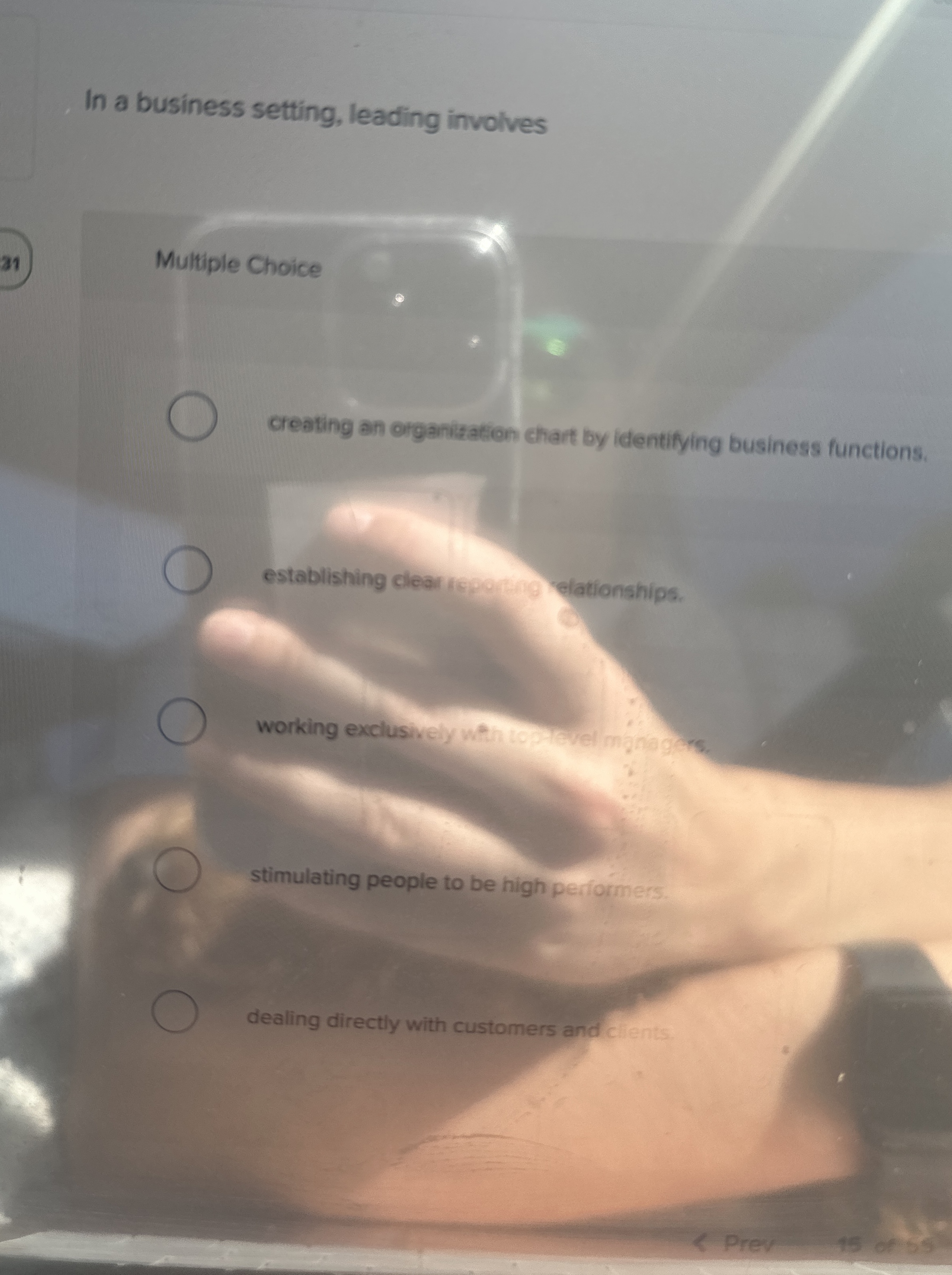  In a business setting, leading involves Multiple Choice creating an organization