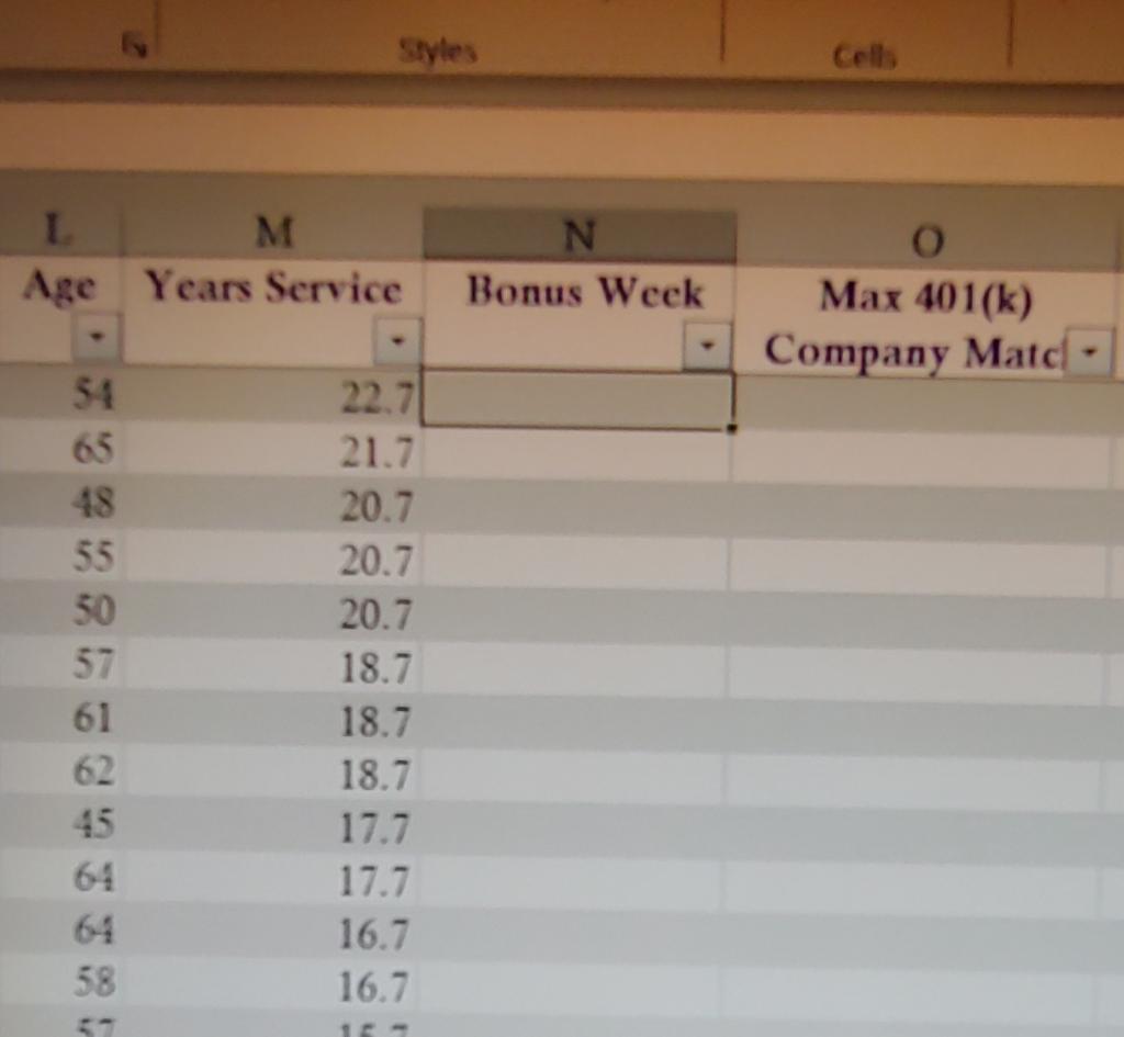 In cell N2, enter a formula using a nested IF