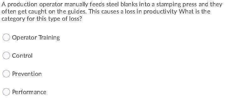 A production operator manually feeds steel blanks