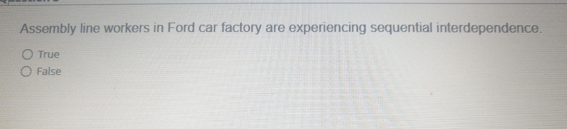 Assembly line workers in Ford car factory are