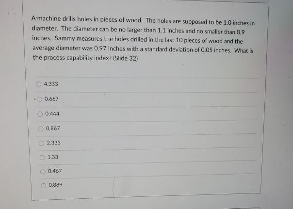 A machine drills holes in pieces of wood. The