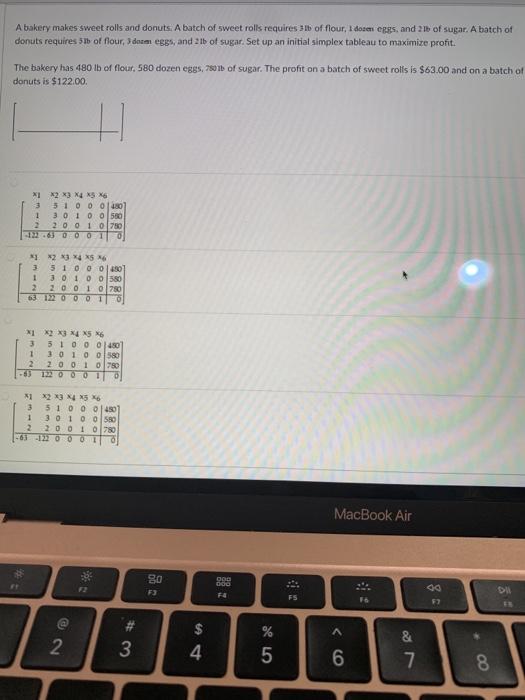 A bakery makes sweet rolls and donuts. A batch of