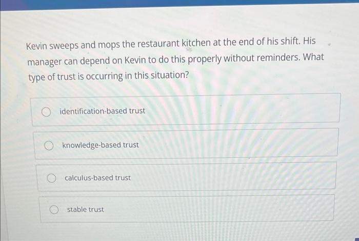 Kevin sweeps and mops the restaurant kitchen at