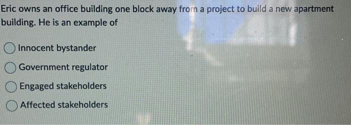 Eric owns an office building one block away from