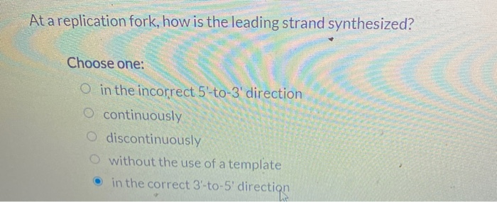 At a replication fork, how is the leading strand