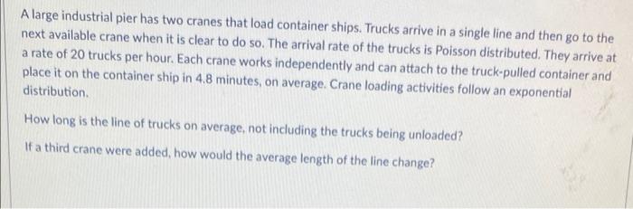 A large industrial pier has two cranes that load