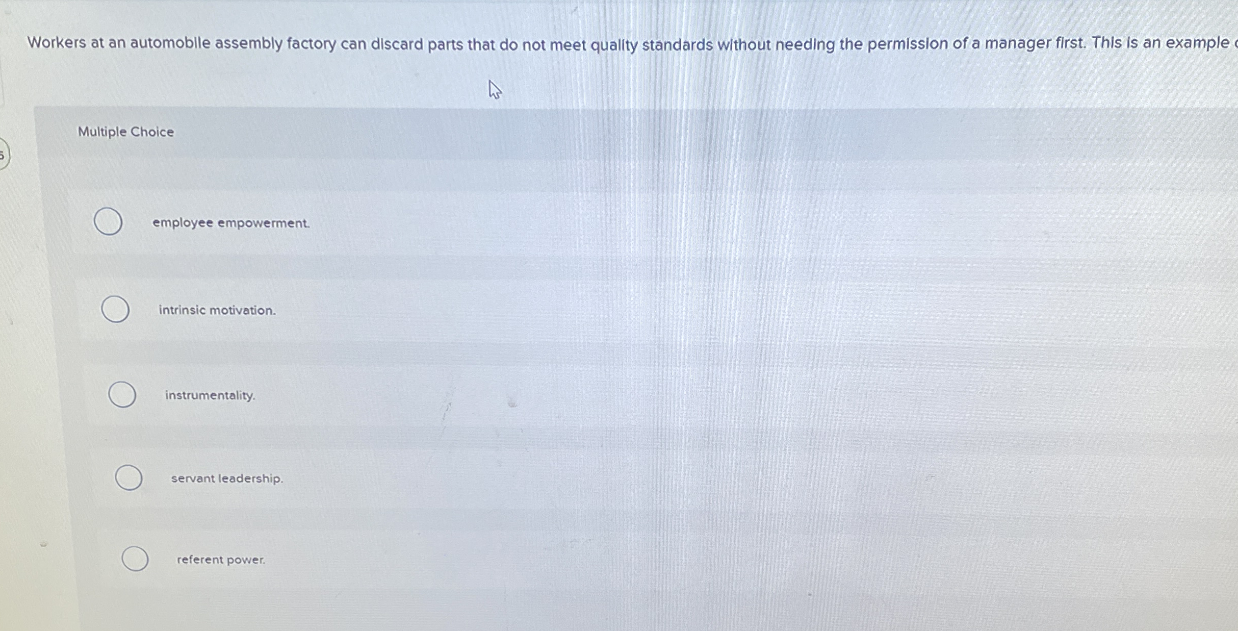 Workers at an automoblle assembly factory can