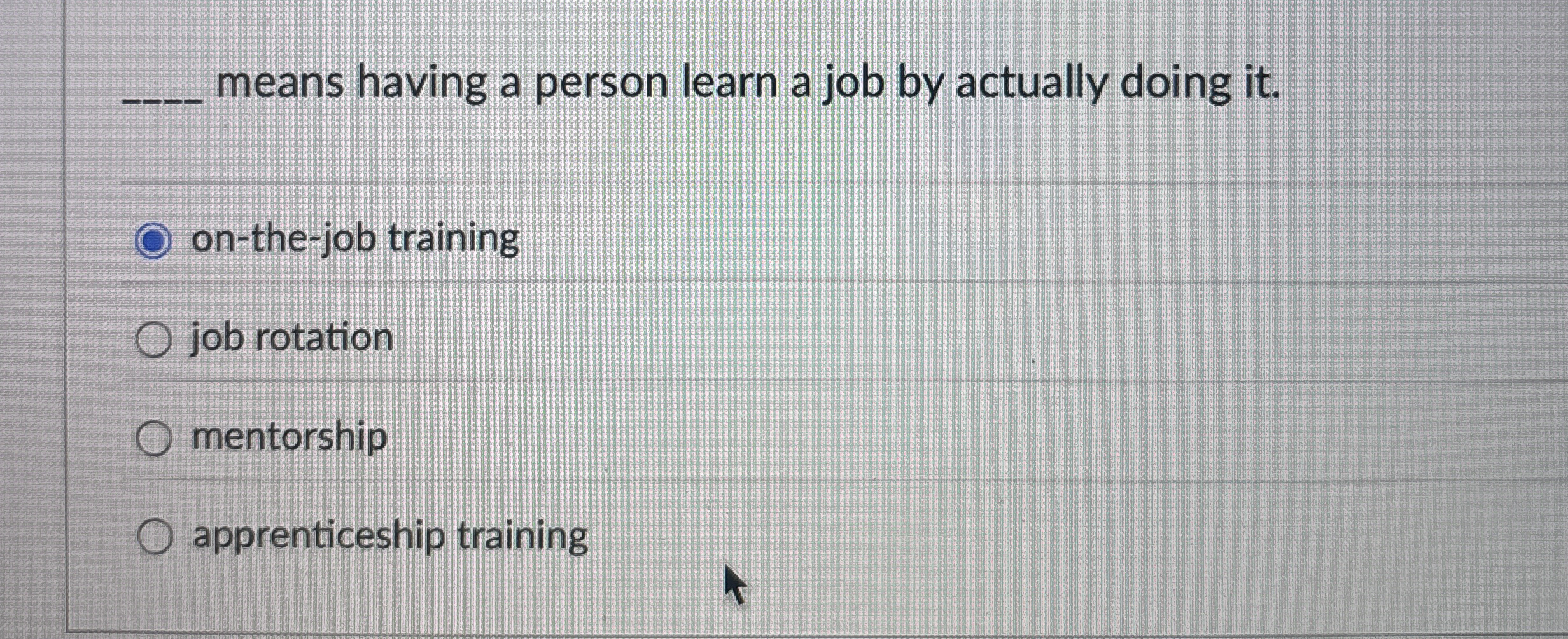means having a person learn a job by actually
