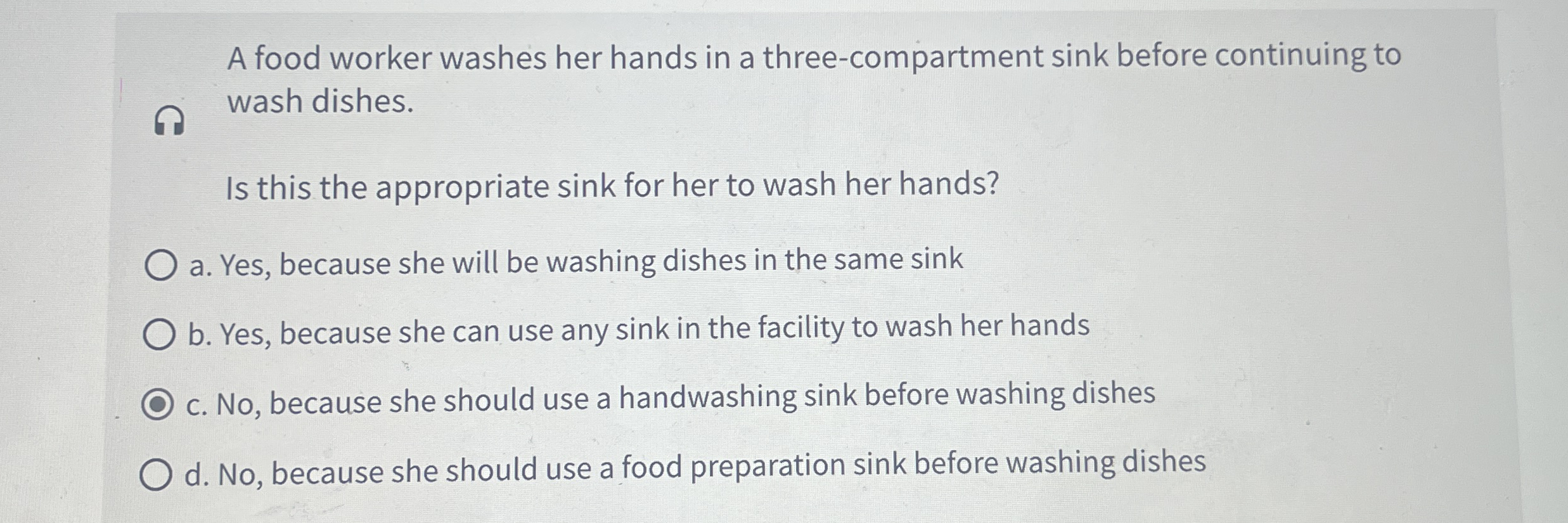 A food worker washes her hands in a three -