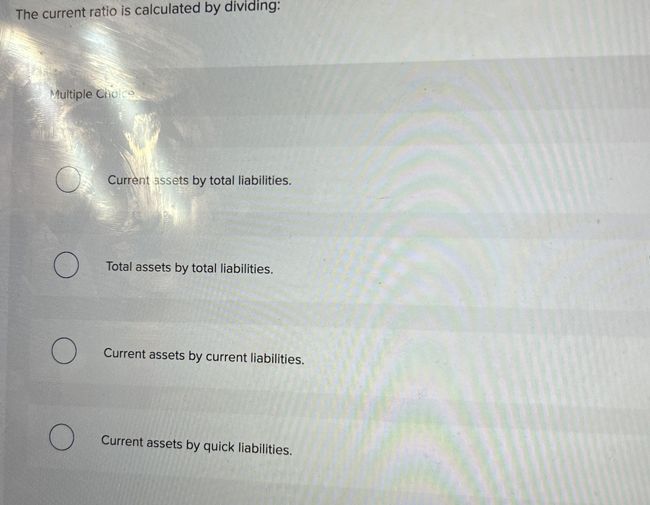 The current ratio is calculated by dividing: