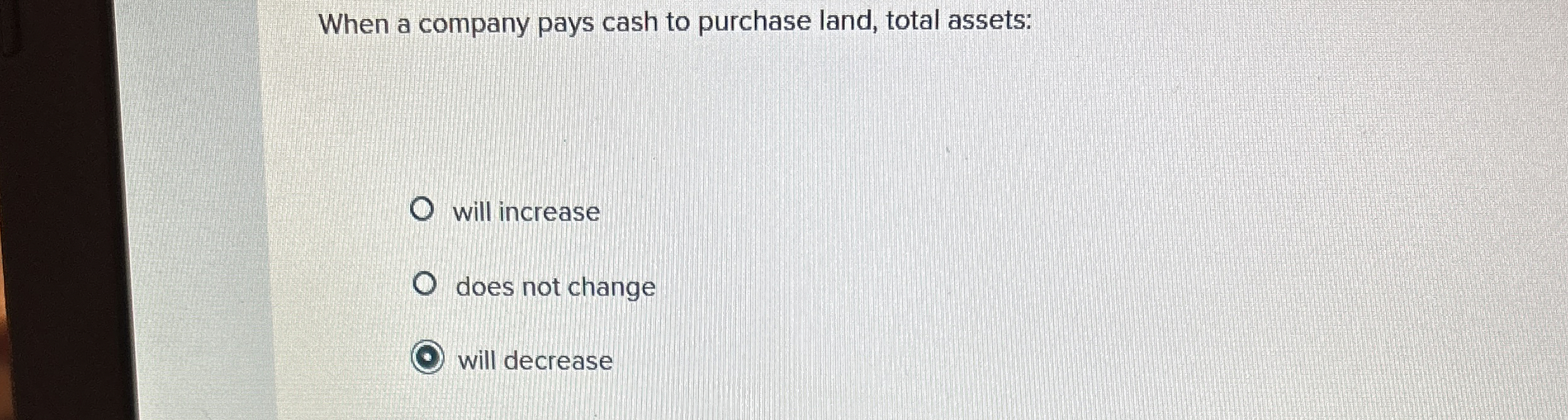 When a company pays cash to purchase land, total
