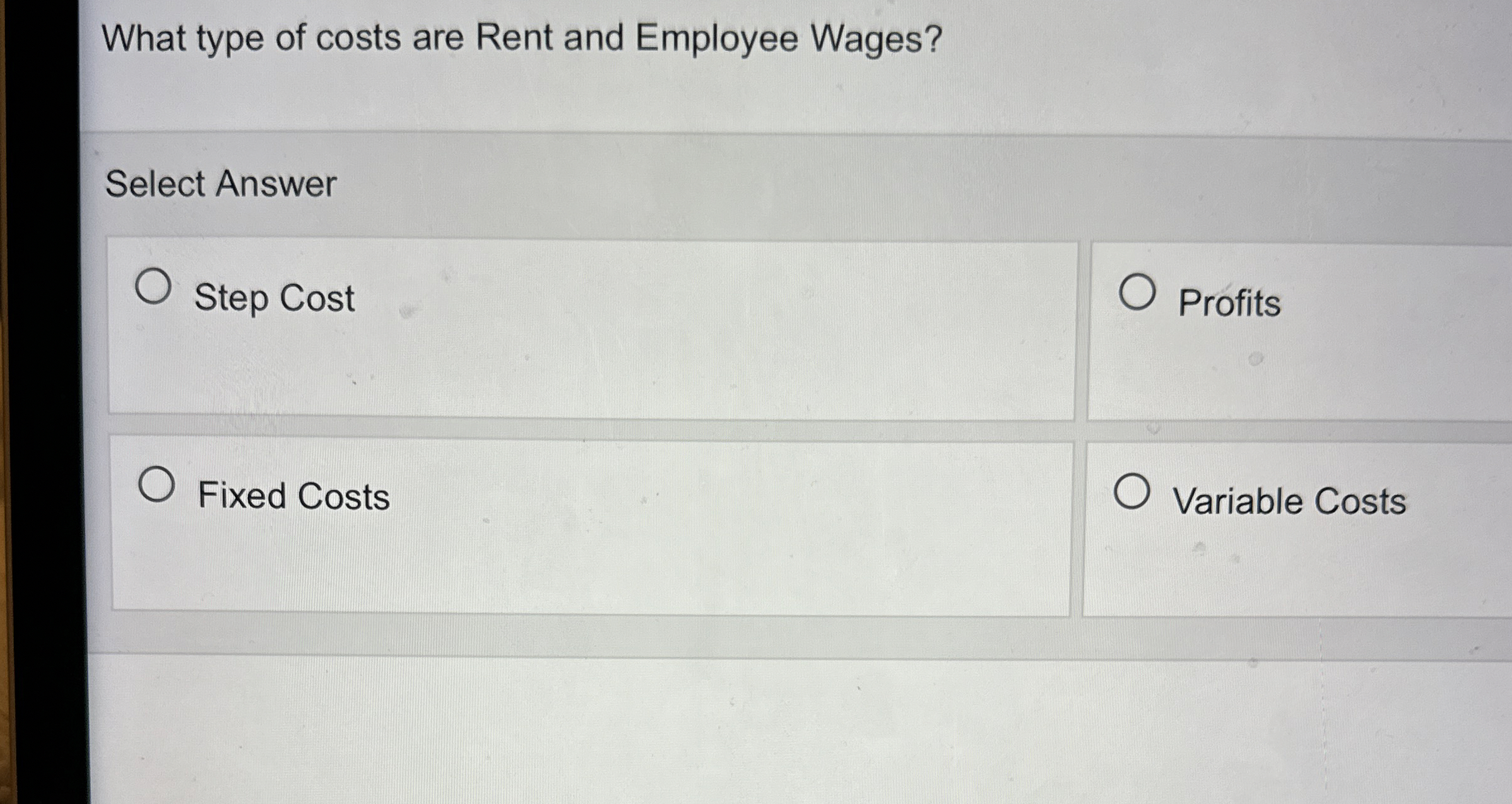 What type of costs are Rent and Employee Wages?