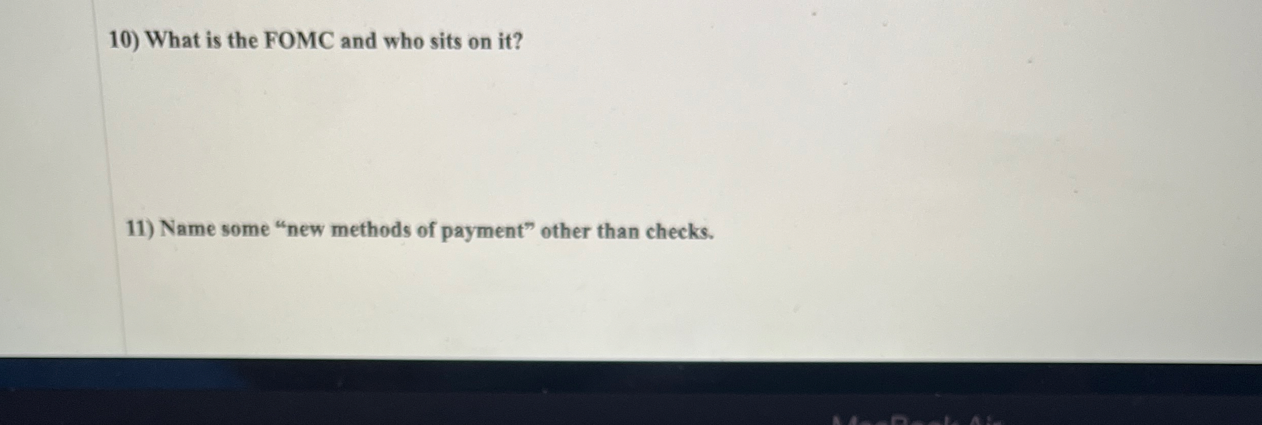 What is the FOMC and who sits on it ? Name some